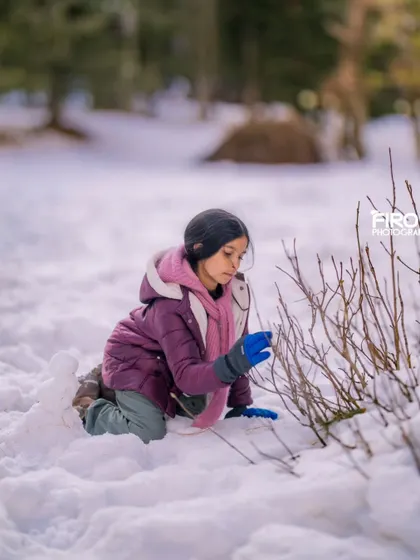 The curiosity of a child exploring the winter landscape. These candid shots of my daughter are some of my most cherished, capturing her real and raw personality.