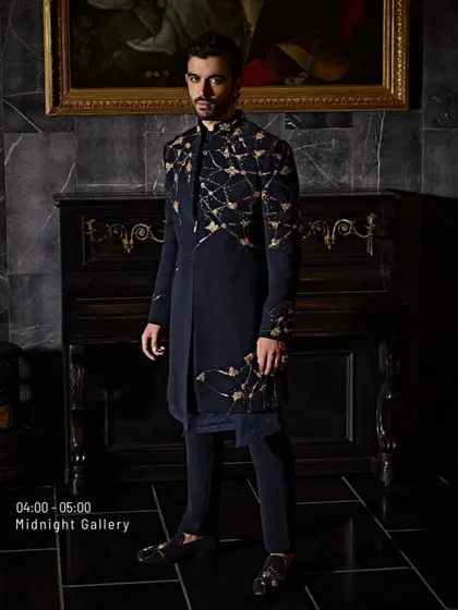 My designs don't just dress you up, they level you up. This black and gold embroidered jacket is a power silhouette, an entrance waiting to happen.