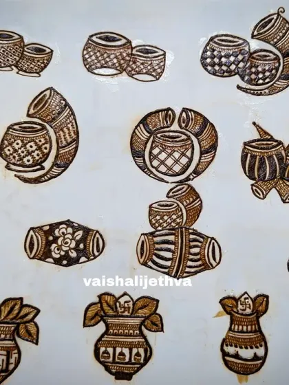 Practicing different filler elements for wedding designs. This sheet shows various styles of dhol, shehnai, and kalash motifs that I use to add detail to my work.