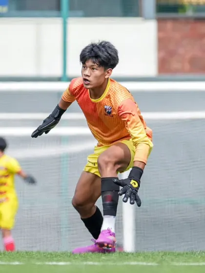 Our goalkeeper in action, alert and ready to command his area during a DPDL Super Cup match.
