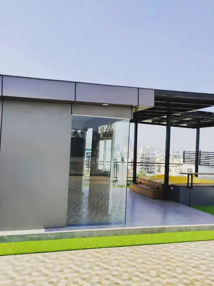 This shot shows the complete setup: a modern prefab room, a covered veranda, and an adjacent open-air jacuzzi, creating a comprehensive luxury rooftop experience.