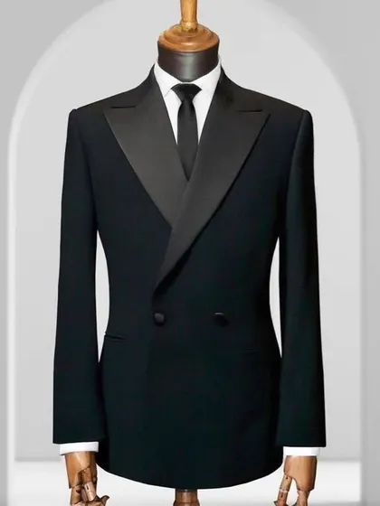 A classic double-breasted black tuxedo jacket. The sharp tailoring and clean lines make it a timeless piece of formal wear.