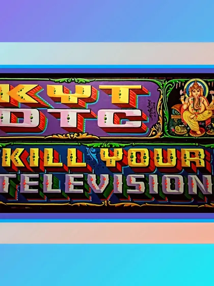 The full "Kill Your TV / Decorate The City" sign, showing the two phrases combined into one powerful art piece.