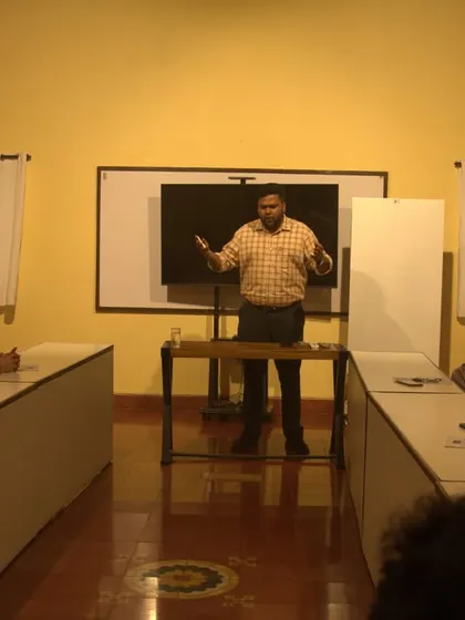 Dr. Arun Gopinath engaging with the audience during a talk on how to bring Ayurvedic balance into daily life.