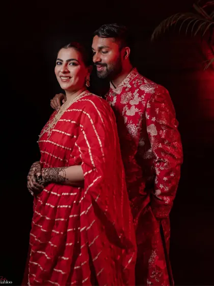 Aashrita and Divyajeet looked stunning in their coordinated red outfits for their Mehendi. This portrait captures their regal elegance and the love between them.