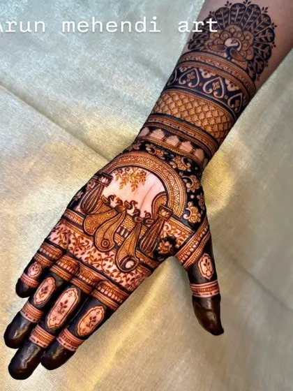 A beautiful back-of-hand design featuring a doli, a classic symbol of a bride's journey.
