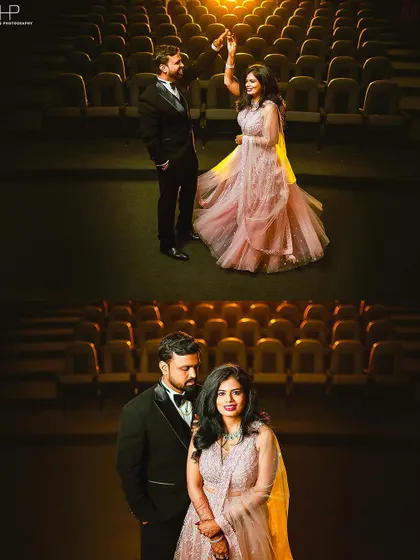 A unique pre-wedding shoot in an empty theater. The warm stage lighting and rows of seats create a dramatic, cinematic backdrop for a glamorous couple portrait.
