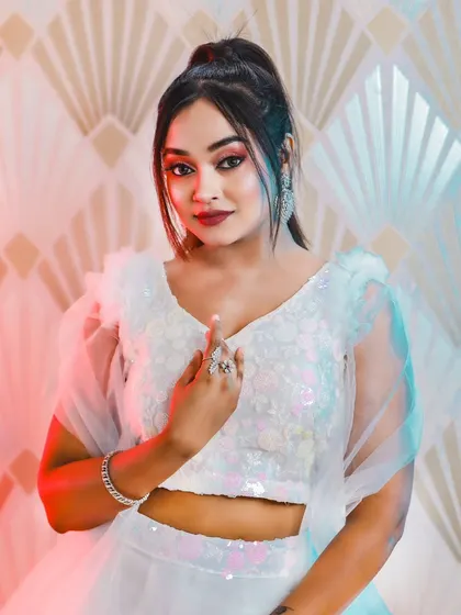 This series of photos and video shows a model in a modern white lehenga, wearing our diamond-look choker set. It's a perfect look for a sangeet or cocktail party.