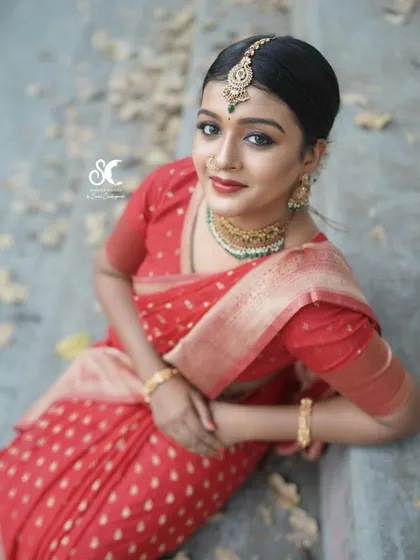 A high-angle shot of the same look, focusing on the model's expression and the beautiful details of her hair and makeup.