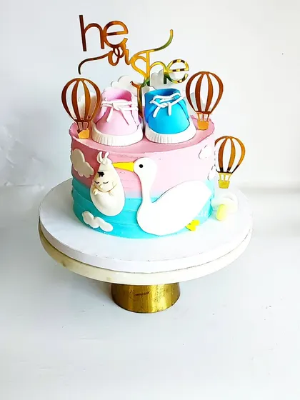 Celebrate your most precious moments with a gorgeous and decadent cake like this one. Perfect for baby showers and gender reveal parties.