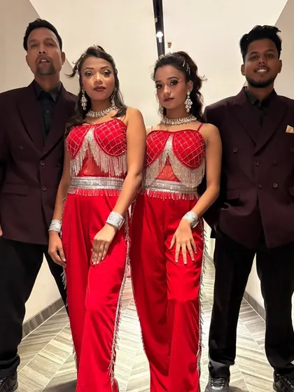 Here is a part of my talented team, ready to bring the energy to an event. Dressed in coordinated red and black outfits, we believe in looking as professional and sharp as our dance moves.