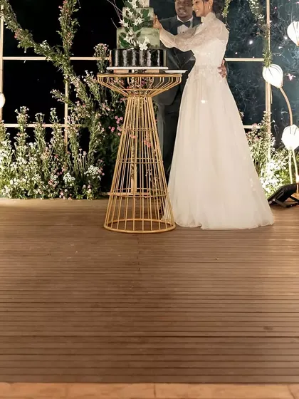 The cake cutting moment, framed by our custom arch and whimsical floor lamps. It’s these picture-perfect moments that I love to create.