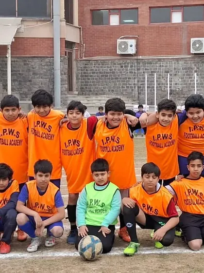 The team lined up before a friendly match against Sanskriti School. These matches are crucial for testing our tactics and giving every player valuable game-time experience on a natural grass field.