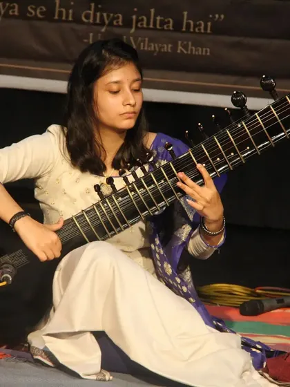 A close up of my student playing with focus during our Gurupoornima event. Learning the sitar is a journey of discipline and passion.