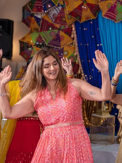 A candid shot of a family member enjoying the dance, full of life and happiness.