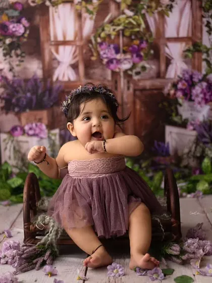 Every little expression is so precious. This darling was an absolute dream to photograph, and her personality shines in this lavender-themed setup.