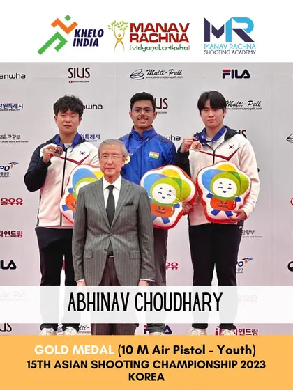 A moment of international glory. Abhinav Choudhary on the podium at the 15th Asian Shooting Championship in Korea, flanked by competitors, after securing the Gold Medal in the 10m Air Pistol Youth Men category.