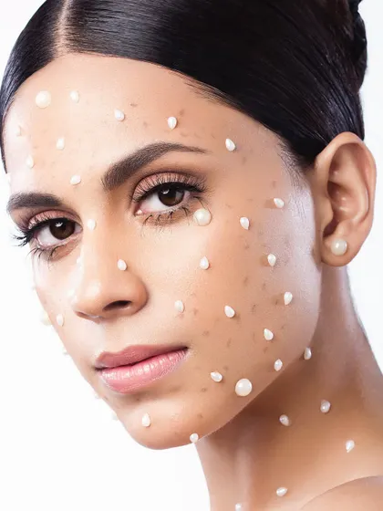 A conceptual beauty shot titled "Queen of Pearls." We used pearls to create a unique texture on the skin, transforming a classic element into something modern and surreal. This is for clients who want to make a memorable artistic statement.