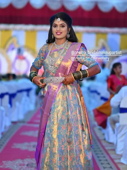 The bride walking down the aisle, showcasing her full reception lehenga and jewellery.