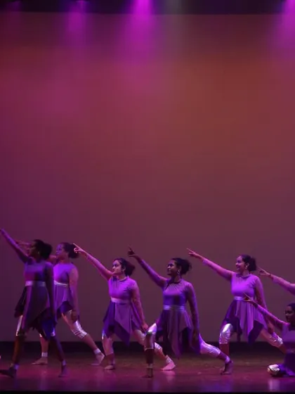 Our contemporary dance students performing a powerful piece in perfect unison. The dramatic lighting and matching costumes amplify the emotional impact of the choreography.
