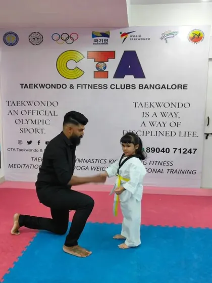 A congratulatory fist bump for one of our youngest students.
