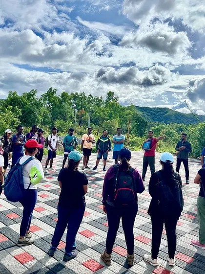 A briefing session with the group at the homestay before we begin our trek. The sky and the mountains in the background are a good sign.