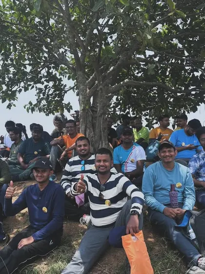Team members resting in the shade of a tree. Our itineraries are well-paced, with enough time for rest and informal team bonding.