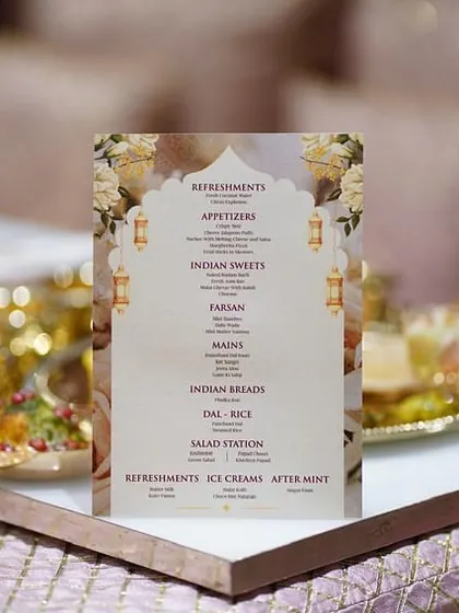 The same elegant menu design, placed on a table as part of the decor. I ensure all branding elements are consistent and stylish.
