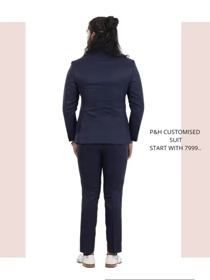 The back view of the navy blue suit, showcasing its traditional and impeccable tailoring.