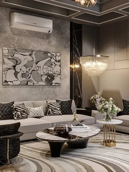 We transformed this basement into a sophisticated living space with a sleek black and grey theme. Coffered ceilings add depth, while mirrors and abstract art create a modern, elegant feel perfect for relaxing or entertaining.