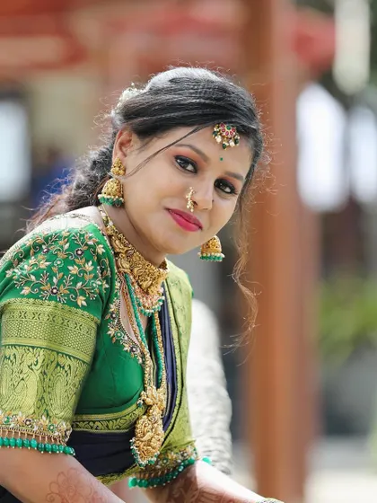A lovely close-up of Dikshitha. The temple choker and matching jhumkas perfectly frame her face.
