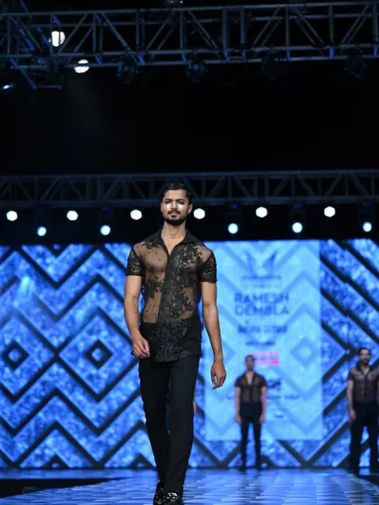 In motion during the Ramesh Dembla show at Mysore Fashion Week, demonstrating the fit and feel of the garment.