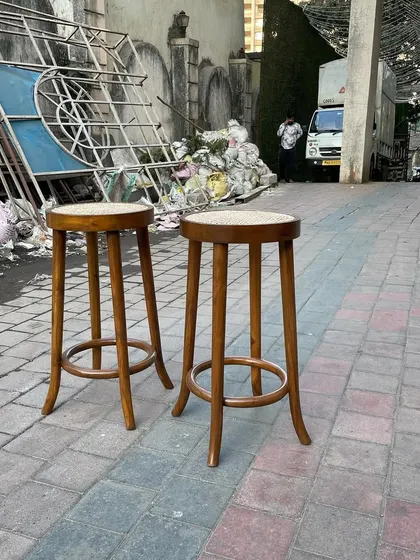 These cane and wood bar stools are ready to be shipped. Their timeless design fits well in both modern and traditional hospitality settings.