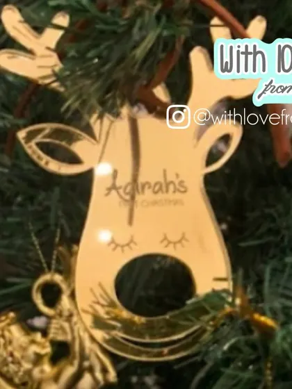 This adorable reindeer-shaped ornament is perfect for celebrating a little one's first Christmas. The gold mirror acrylic catches the light beautifully on the tree, and it's personalized with the child's name.
