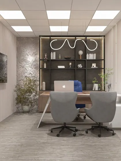 This minimalist office cabin for a factory owner in Neemrana features a textured stone wall, sleek shelving, and a unique pendant light, creating a luxe and modern feel.