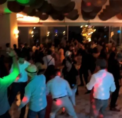 The dance floor is full at this late-night corporate offsite party.