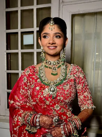 A beautiful portrait of a traditional bride. Her eyes are softly defined, and her skin has a natural, healthy glow.