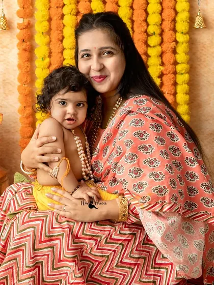 Another lovely mother and child portrait, capturing a quiet moment during the Janmashtami festivities in the studio.