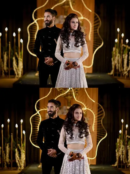 The couple posing on stage during their ring ceremony.