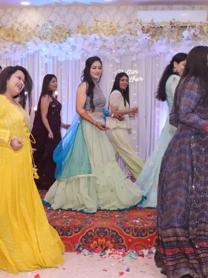A candid shot of the bride and her squad on stage. I love capturing these moments of pure fun and celebration during a group performance.