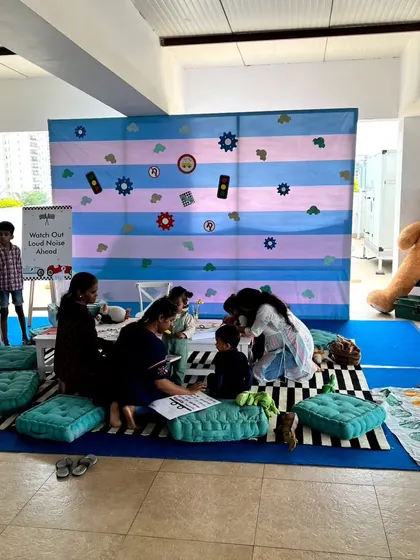 I create dedicated play areas for the little ones. At the Dinky Car party, this corner had soft floor cushions and themed toys to keep the youngest guests happy and engaged.