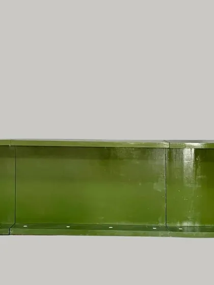 A slightly different angle of the green oval bar counter, showcasing its curved and elegant shape.