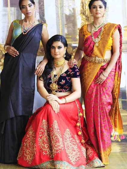 Here you can see how my custom bridal lehenga, featuring a red skirt and navy velvet blouse, coordinates beautifully with other traditional Indian wedding attire like classic silk sarees.
