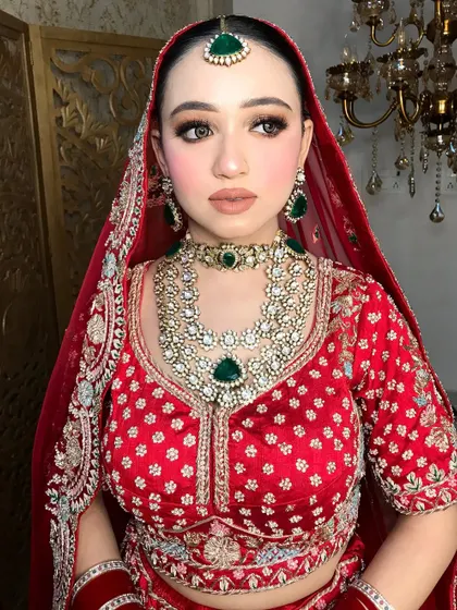 Another angle of this timeless bridal look, showing the perfect blend of traditional attire and modern, understated makeup.