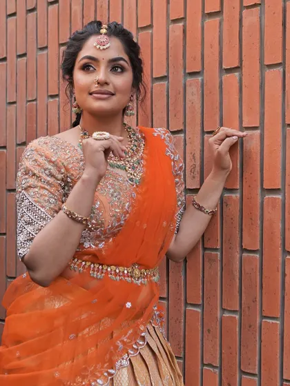 The delicate waist belt, or kamarbandh, adds a finishing touch to the lehenga look.