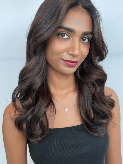 A front view of the Matryoshka balayage. Notice how the color frames the face and enhances the client's features, a key focus in our hair color training.