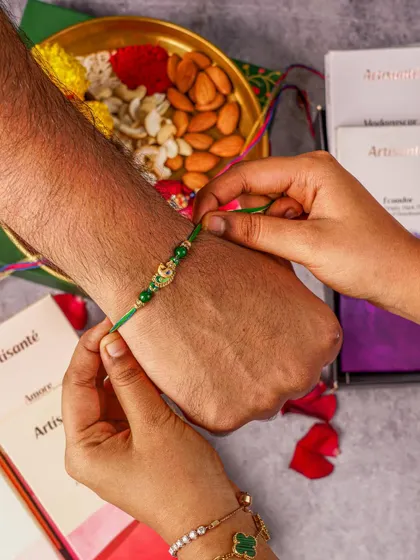 A heartfelt moment of a sister tying a rakhi. We capture these emotional, story-driven shots to build a deeper connection between your brand and your audience during festive seasons.