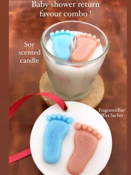 Here's a cute baby shower return favor combo. It includes a soy scented candle with baby feet toppers and a matching wax sachet that can be used as a fragrance bar for closets.