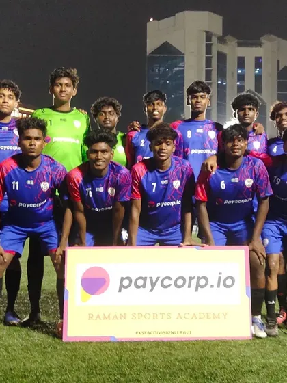 Our senior team posing with the sponsor board after a 4-0 win.