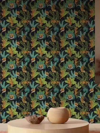A vibrant and detailed jungle-themed wallpaper with a repeating tiger pattern. The dark background makes the green and orange tones pop, creating a rich and immersive design for a bold interior.